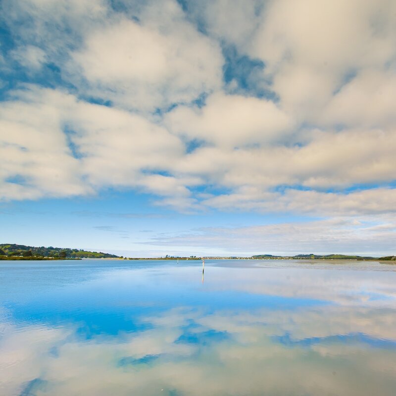 Calm water reflecting clouds