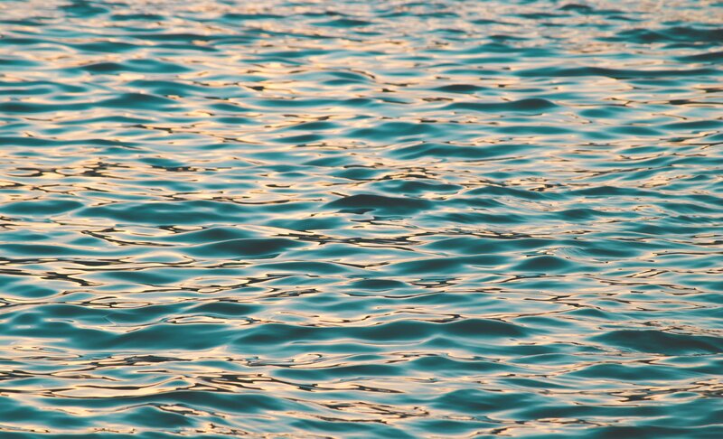 calm water surface at sunset