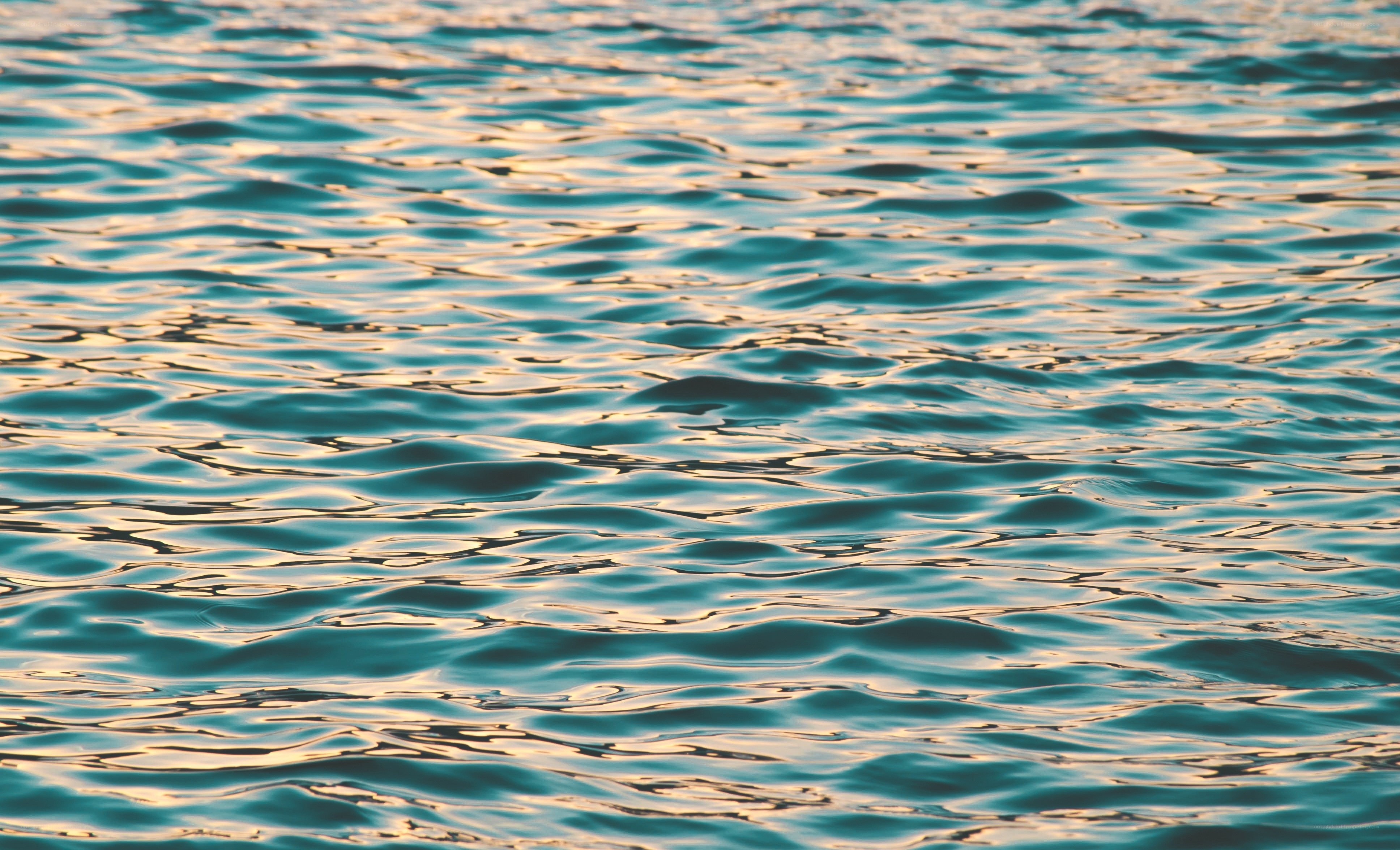 calm water surface at sunset
