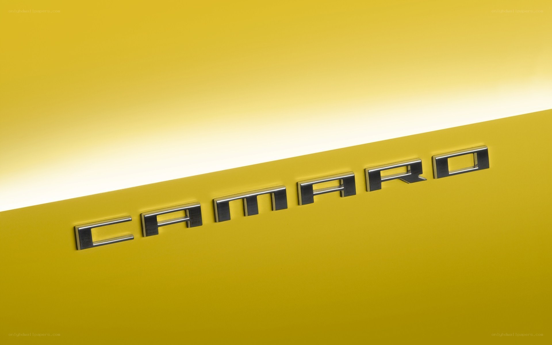 Camaro emblem on yellow car