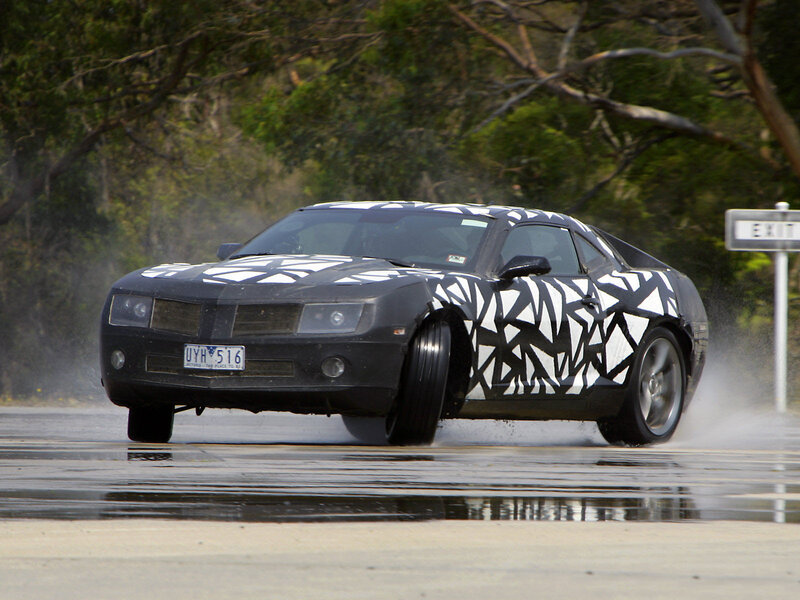 camaro test car on wet road
