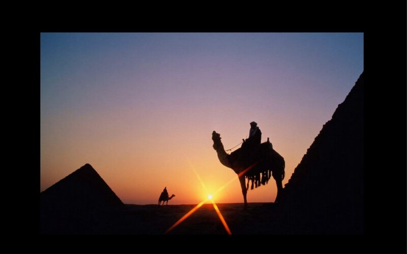 Camel Riders at Sunset — Orange, Dramatic