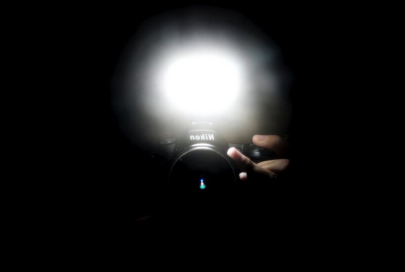 camera flash in darkness