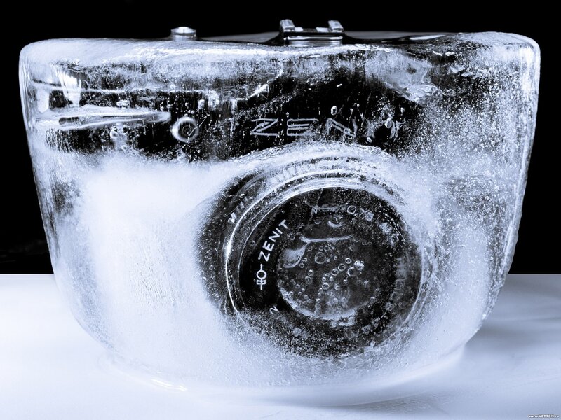 Camera in Ice Block — White, Dramatic, Photograph
