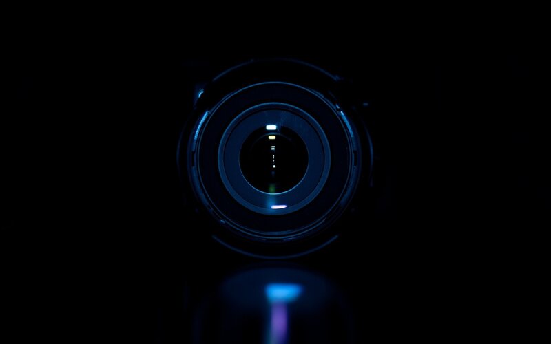 camera lens in dark room