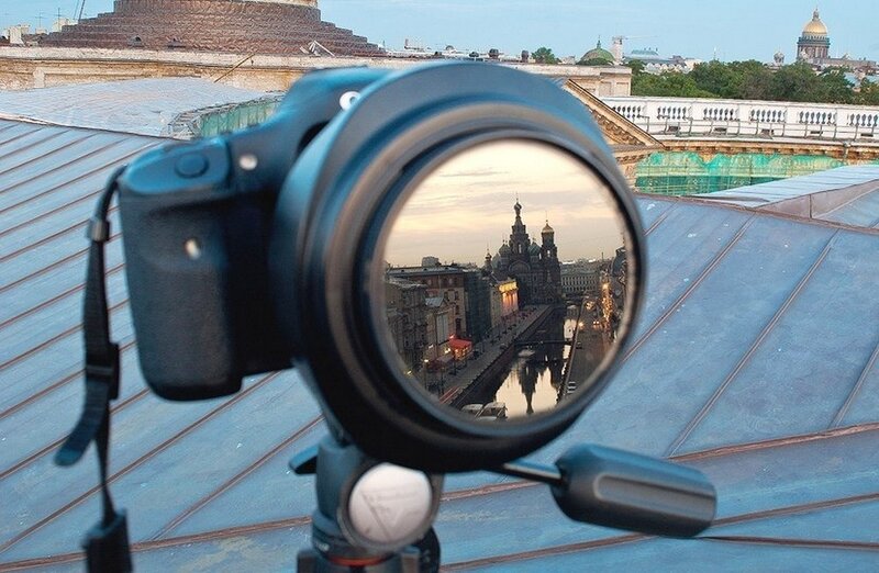 Camera on a rooftop with city view