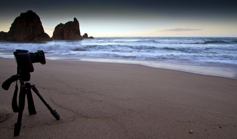 Camera on beach at sunset