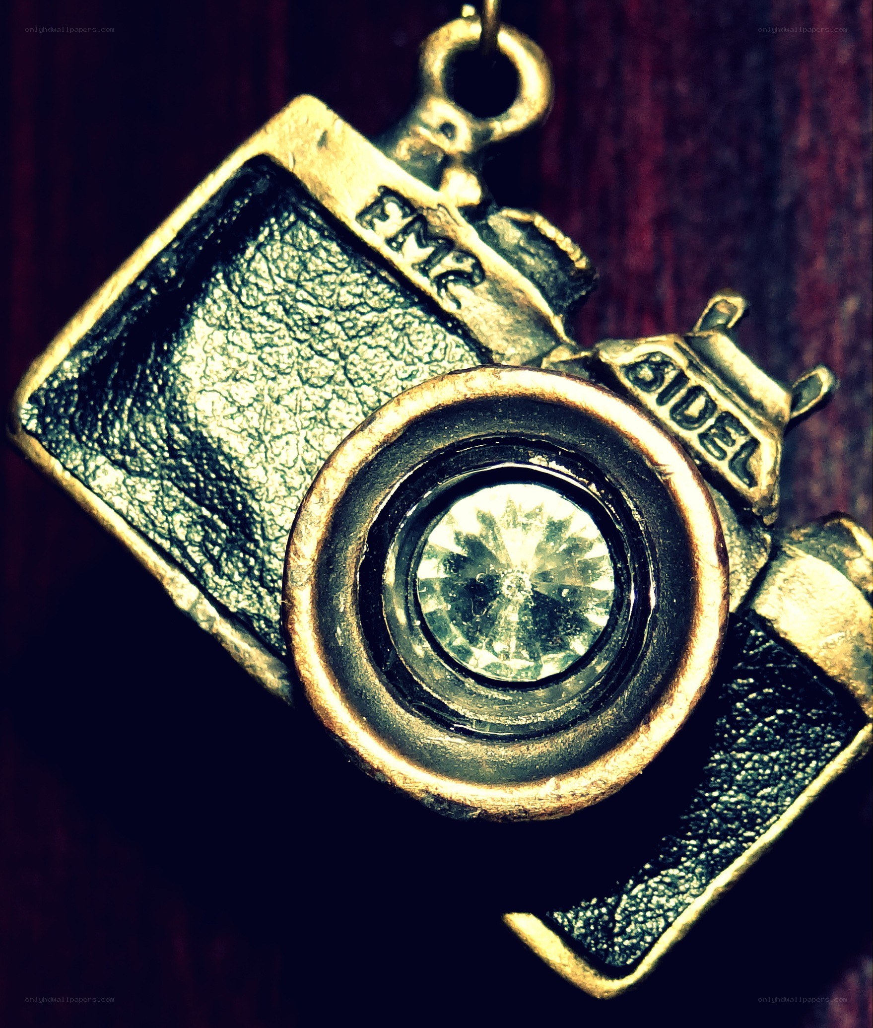 camera-shaped pendant with crystal lens