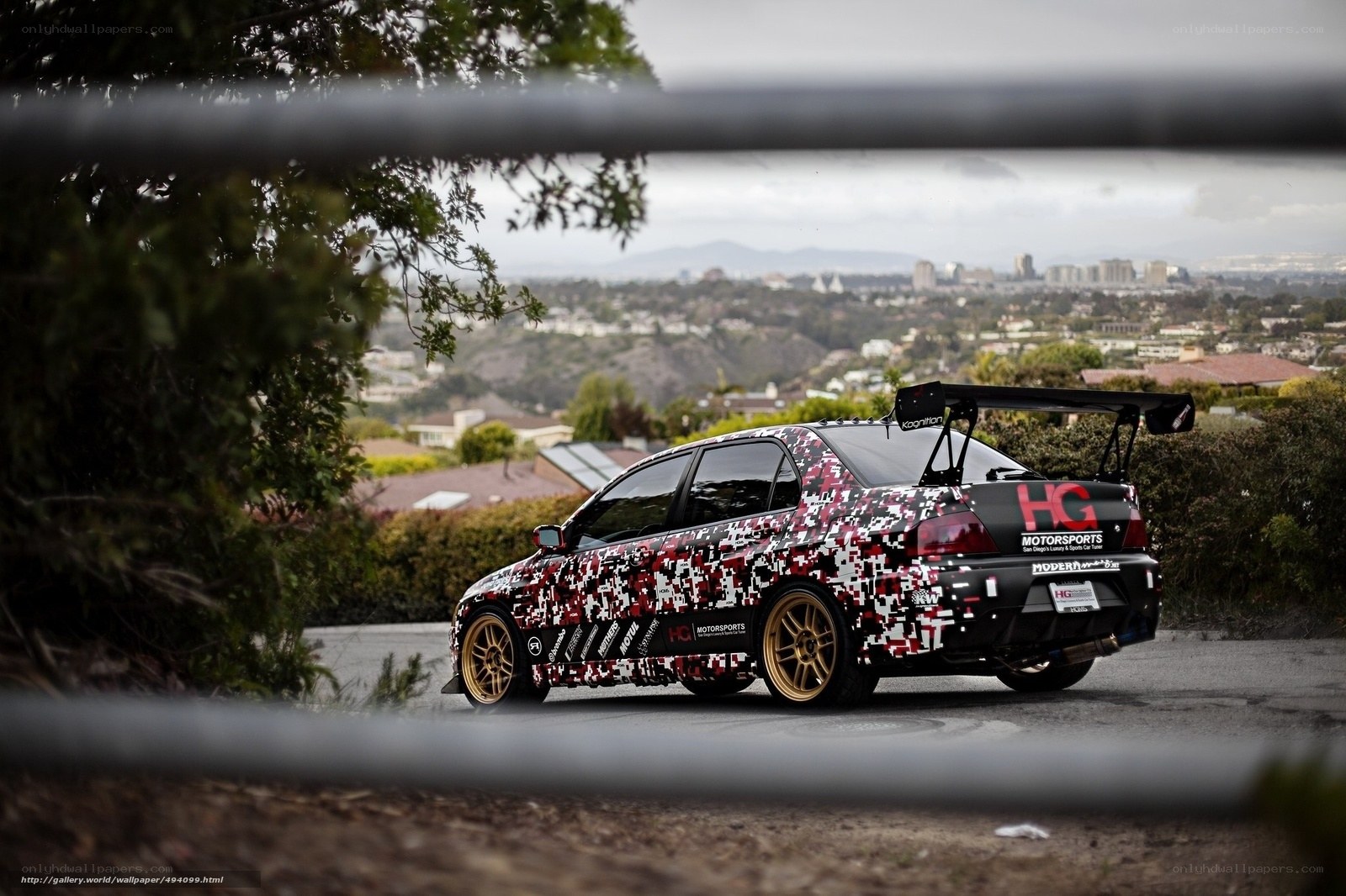camo car on a hill