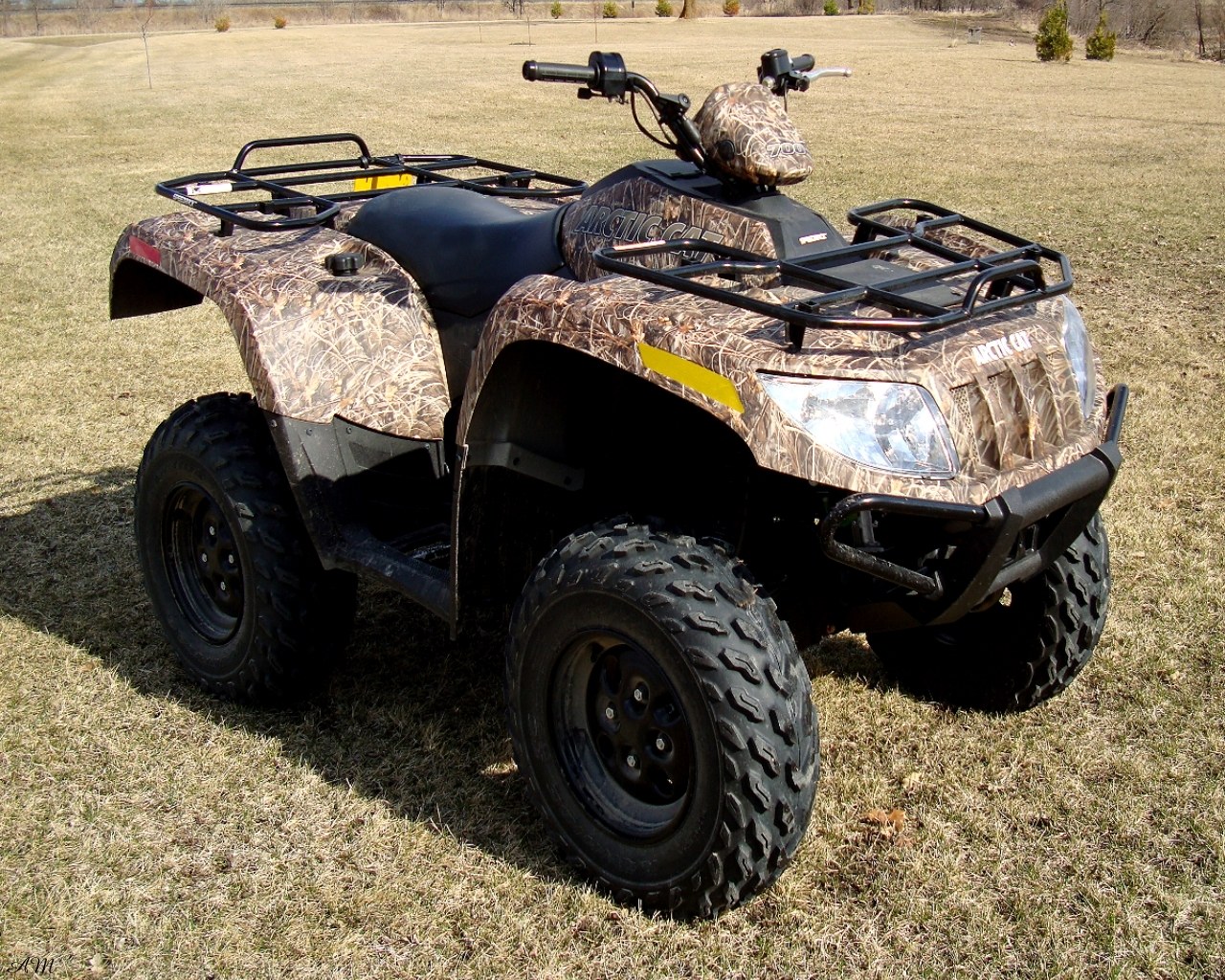 camo-patterned ATV in field