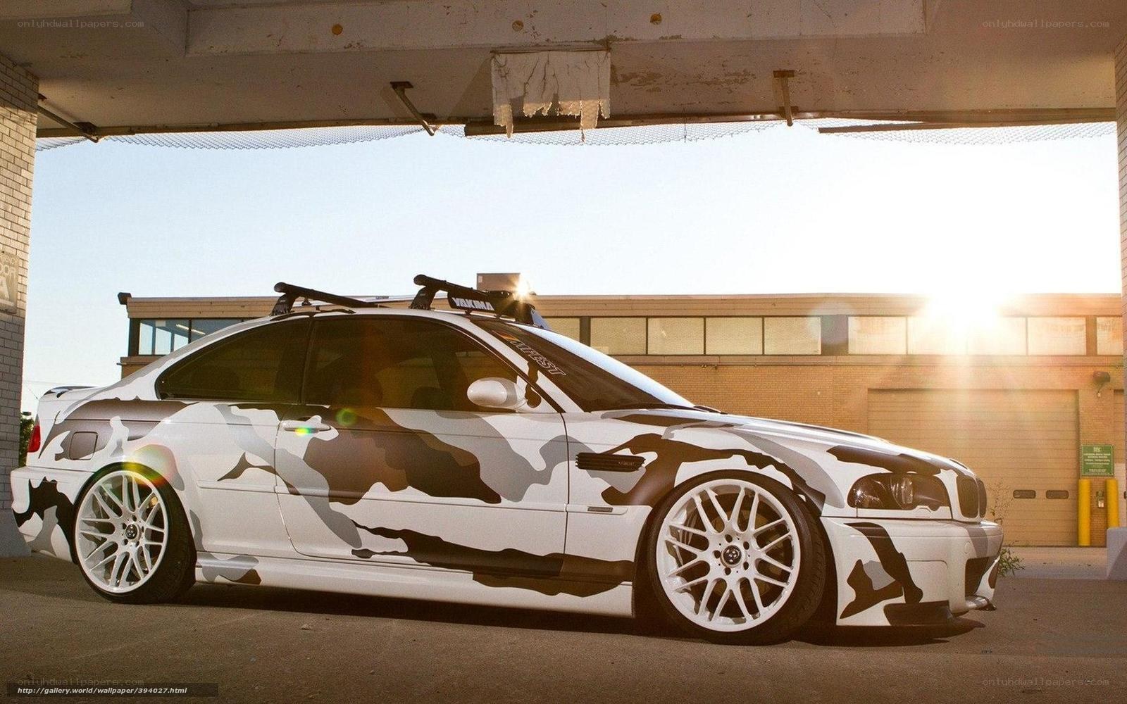 camouflage BMW under overpass