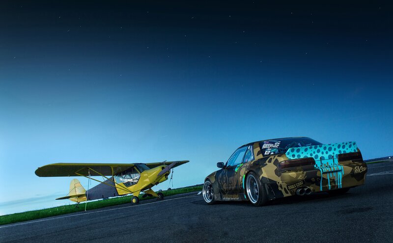 Camouflage Car and Yellow Plane