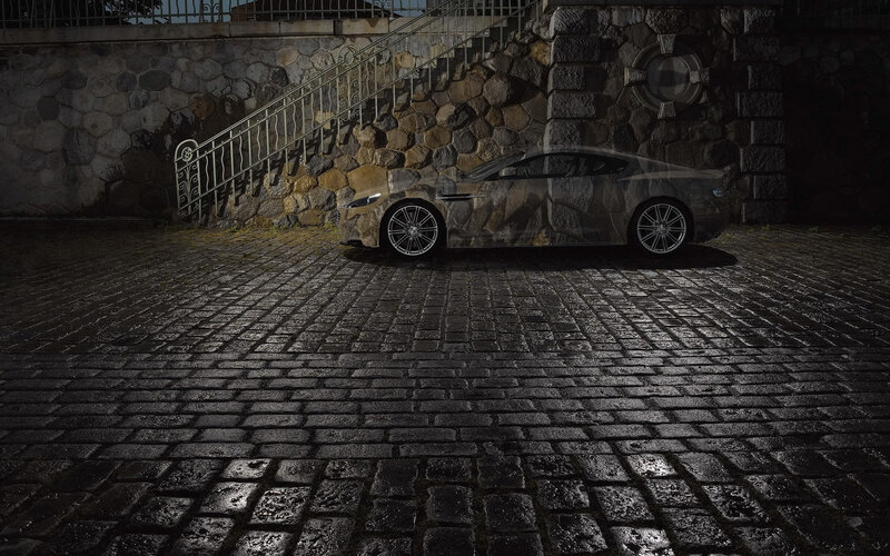 camouflage car on cobblestones