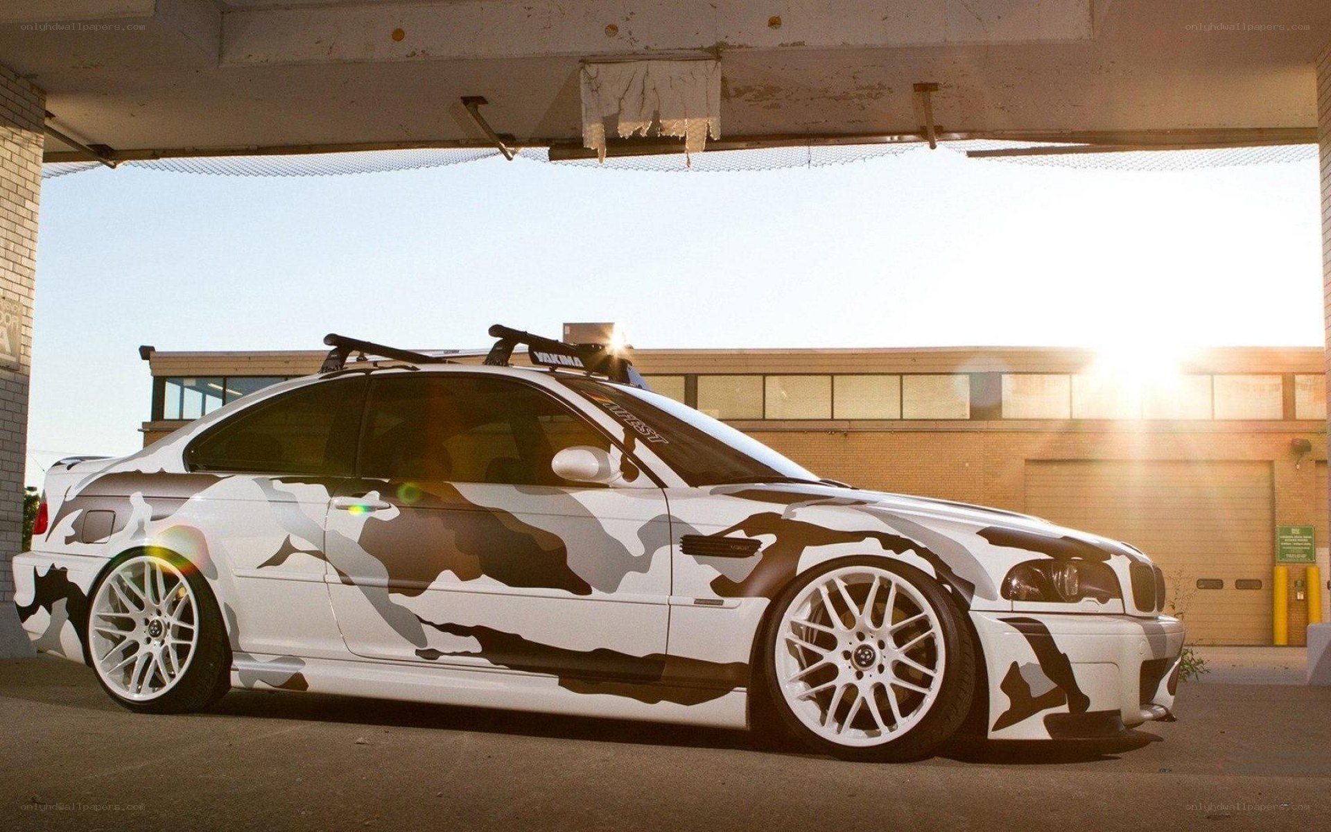 camouflage car under overpass