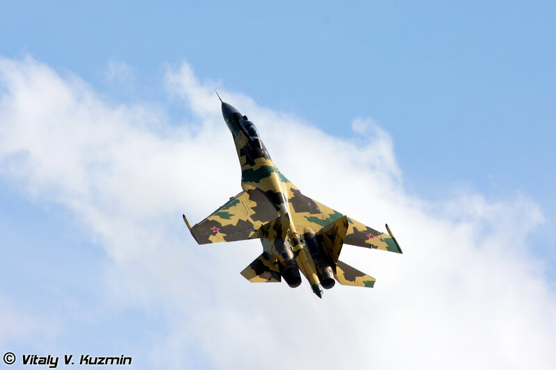 Camouflage Fighter Jet — Blue, Dynamic, Afternoon, Photograph, Sky, Clouds, Missiles, White