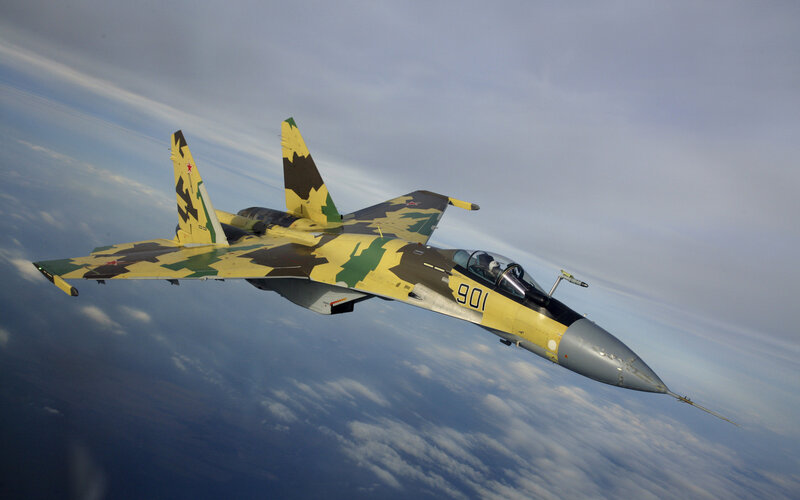 Camouflage Fighter Jet — Yellow, Dramatic, Photograph, Clouds