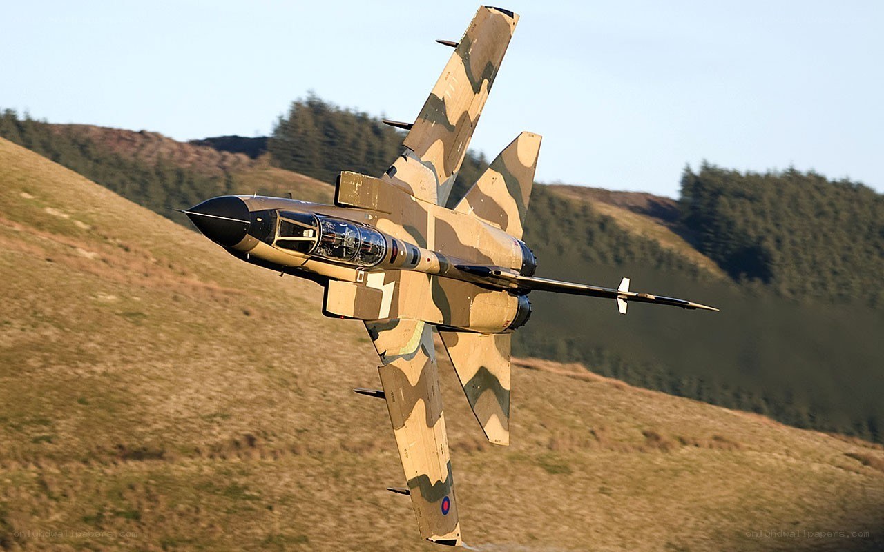 camouflage jet in flight
