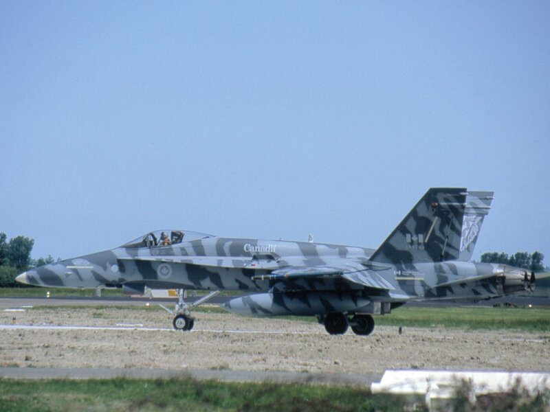 Camouflage Jet on Runway — Gray