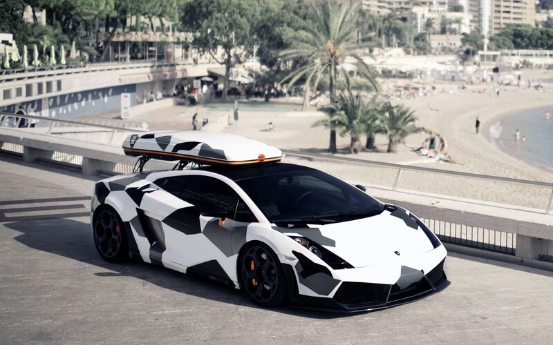 camouflage Lamborghini on beach promenade