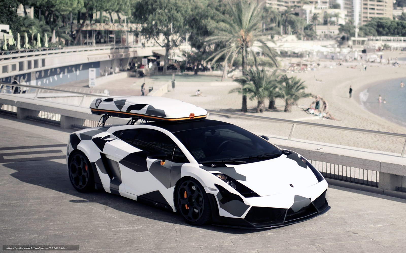 camouflage Lamborghini on beach promenade