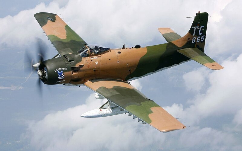 camouflage military aircraft in flight