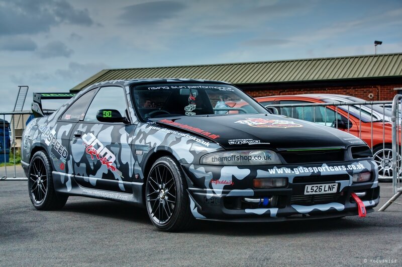 camouflage-painted sports car