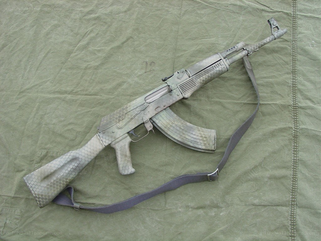 camouflage-patterned assault rifle