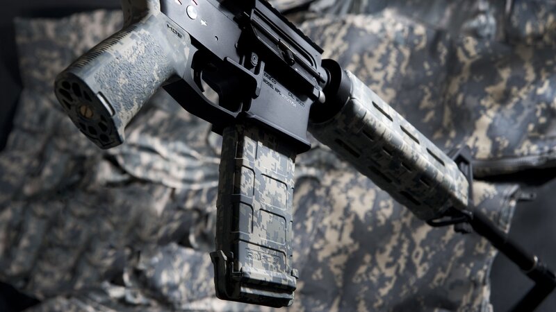 camouflage-patterned rifle