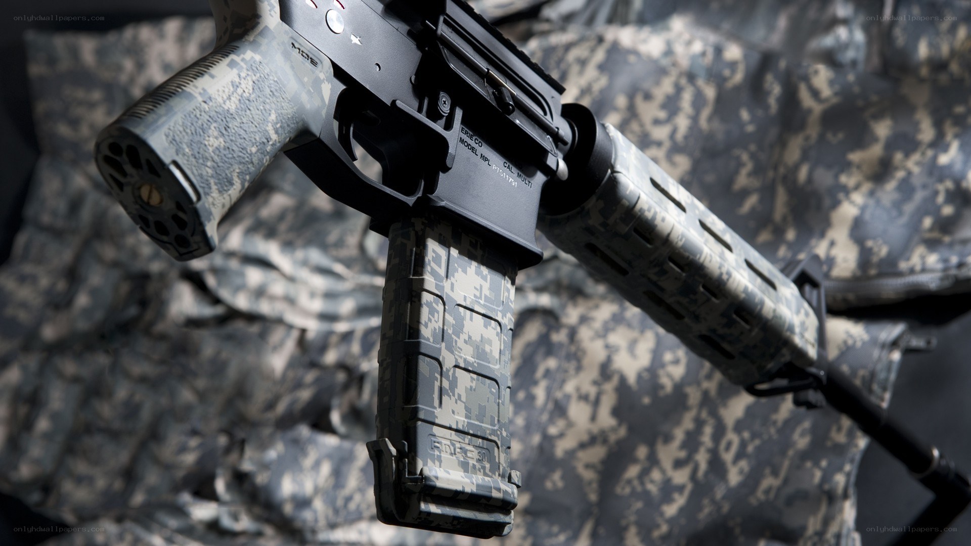 camouflage-patterned rifle