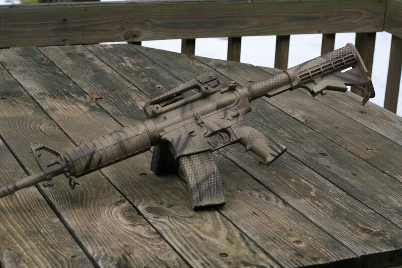 Camouflage Rifle on Table