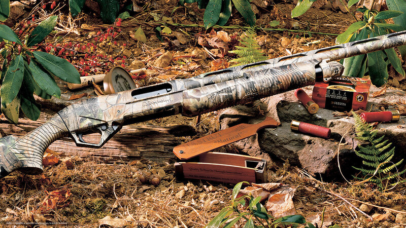camouflage shotgun in forest