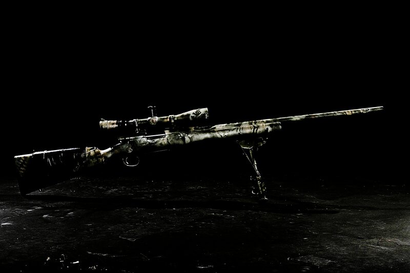 camouflage sniper rifle