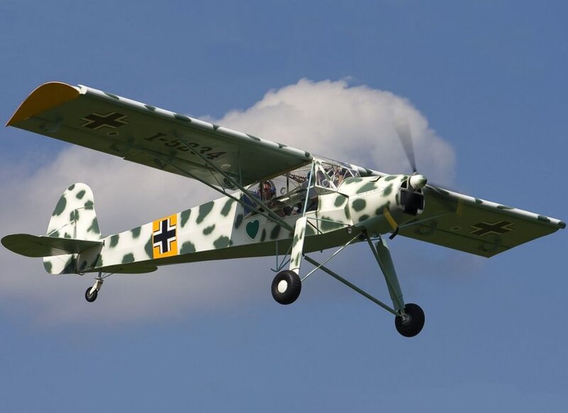 Camouflaged Biplane in Flight