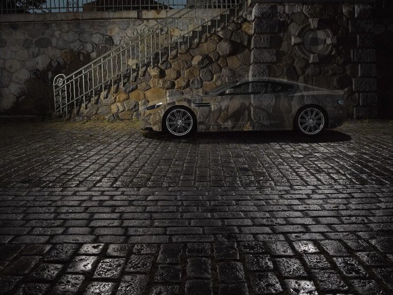 camouflaged car on cobblestones