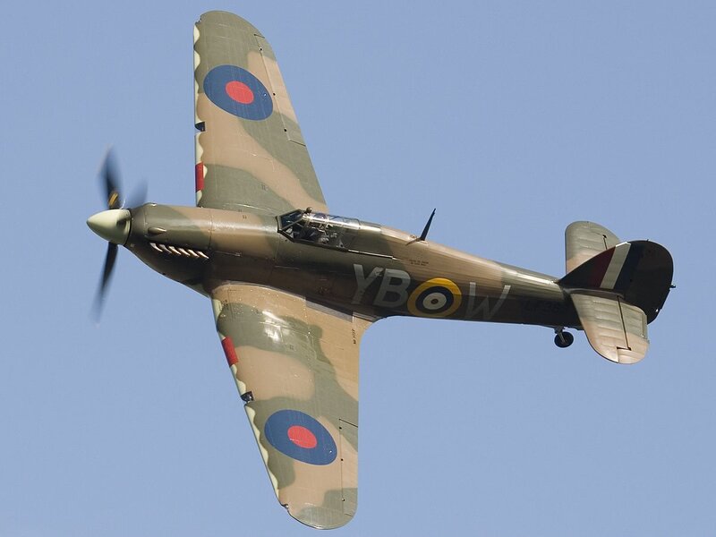 Camouflaged fighter plane in flight