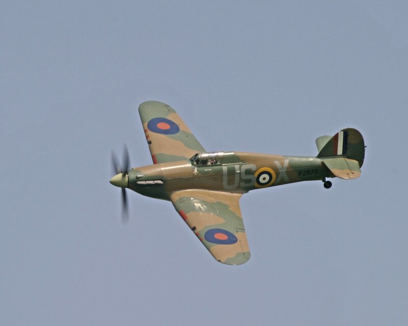Camouflaged fighter plane in flight