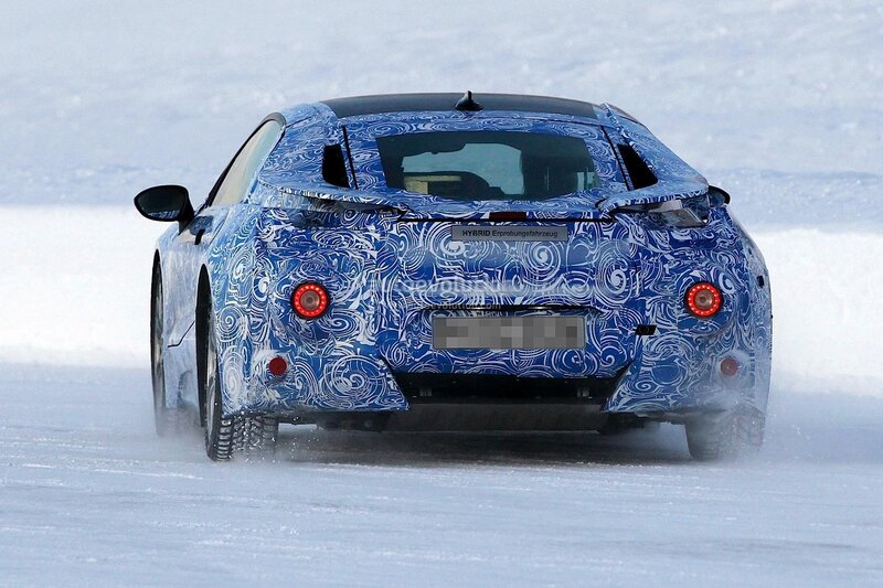 camouflaged hybrid car on snow