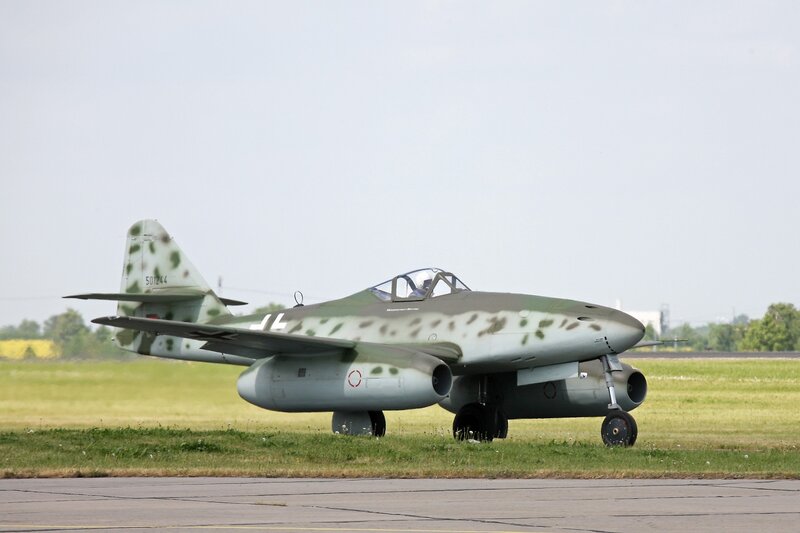 Camouflaged Jet Aircraft — Green, Calm, Afternoon