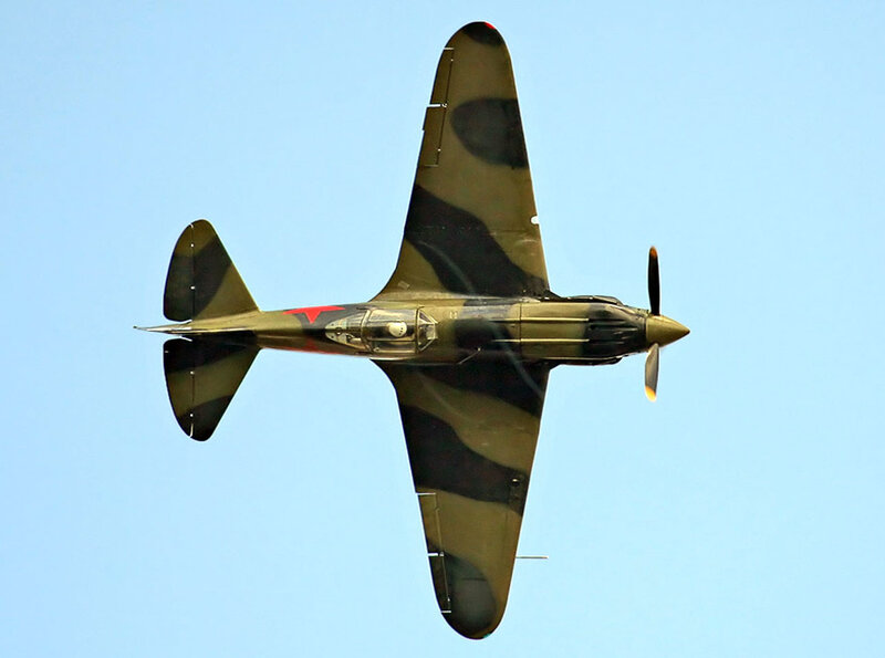 camouflaged military aircraft in flight