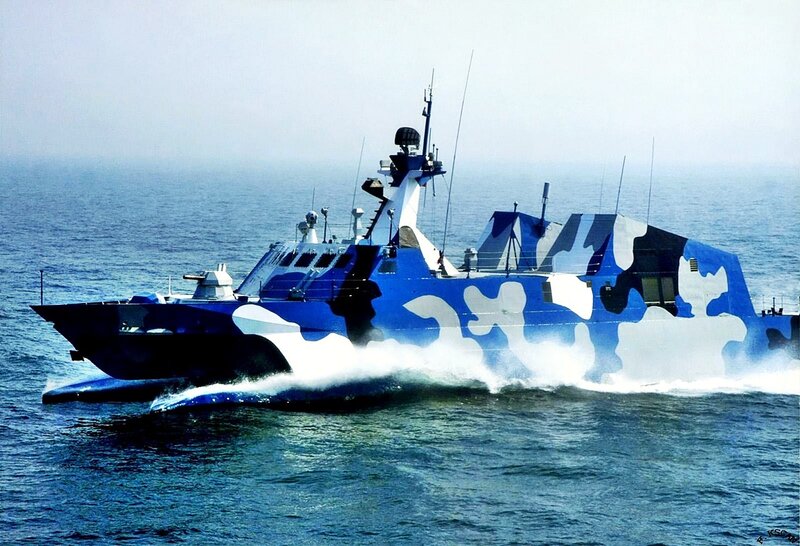 camouflaged military patrol boat