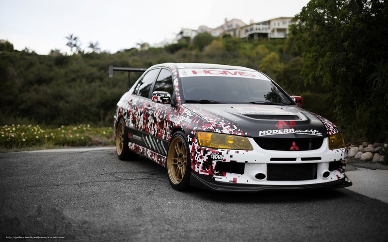 camouflaged race car on road