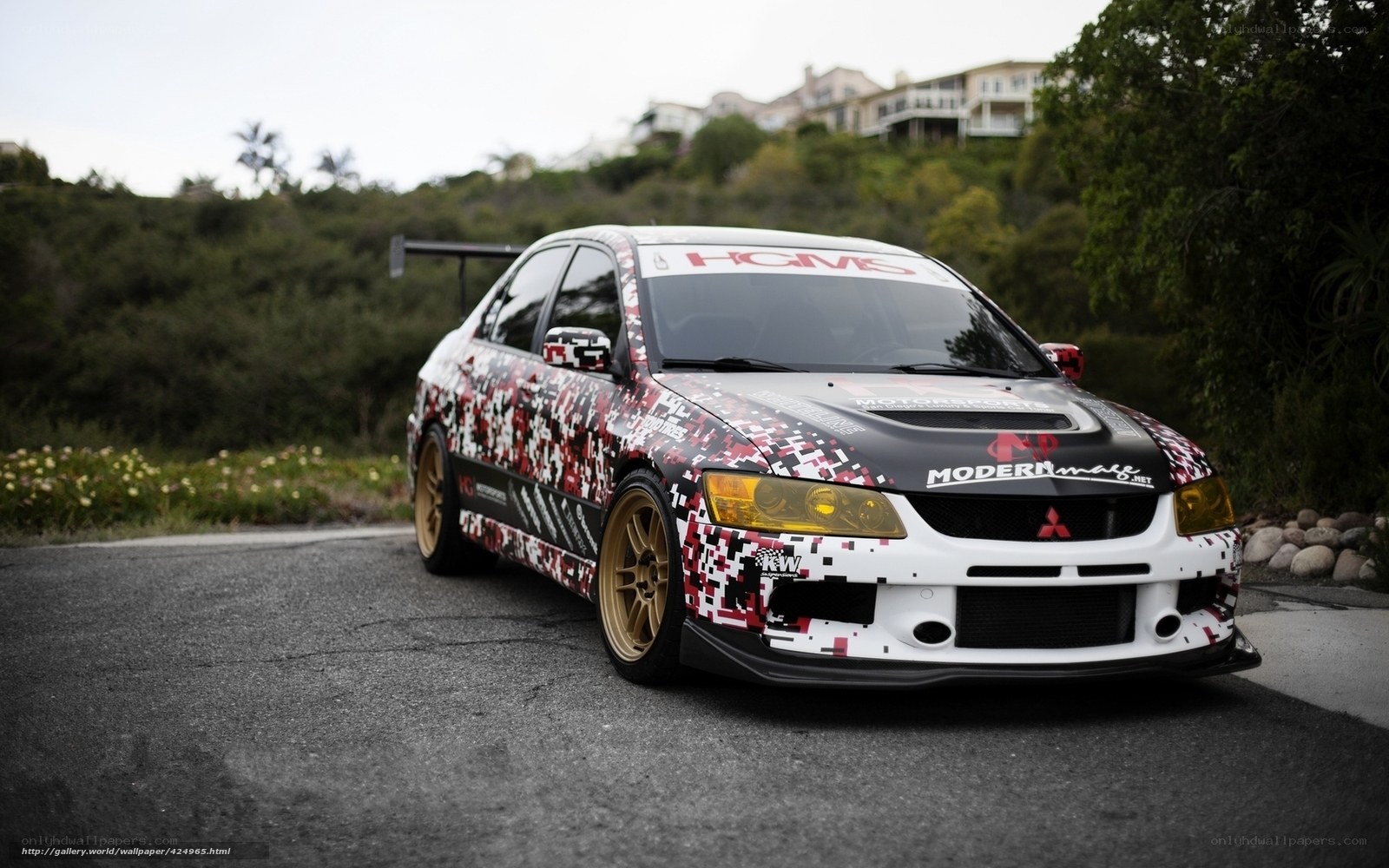 camouflaged race car on road