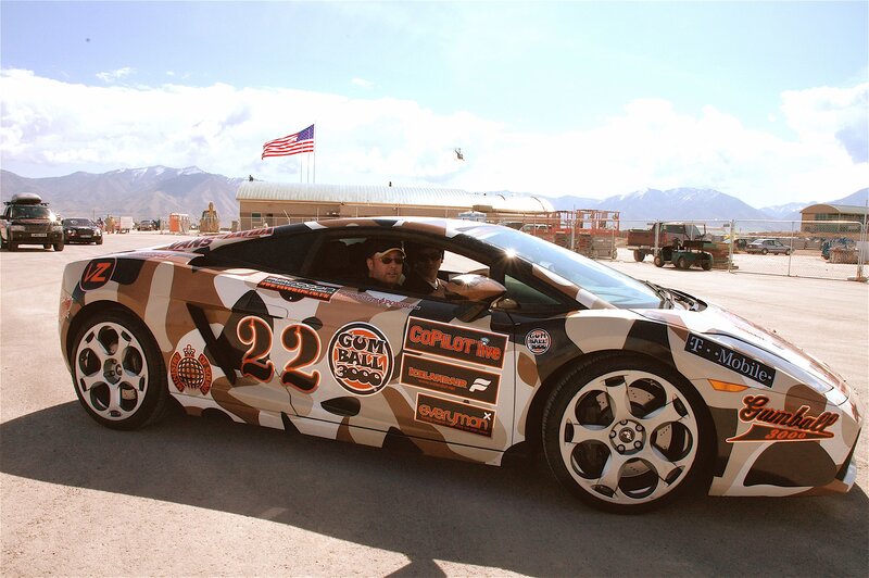Camouflaged race car on tarmac