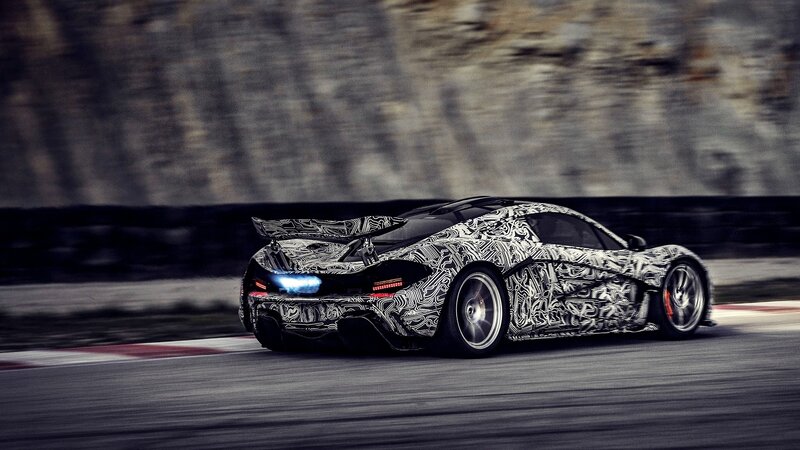camouflaged sports car on track