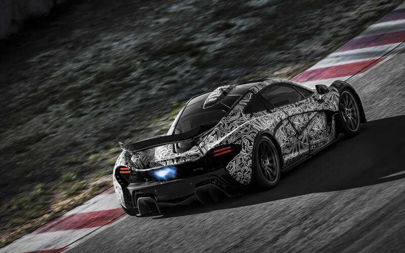 camouflaged sports car on track