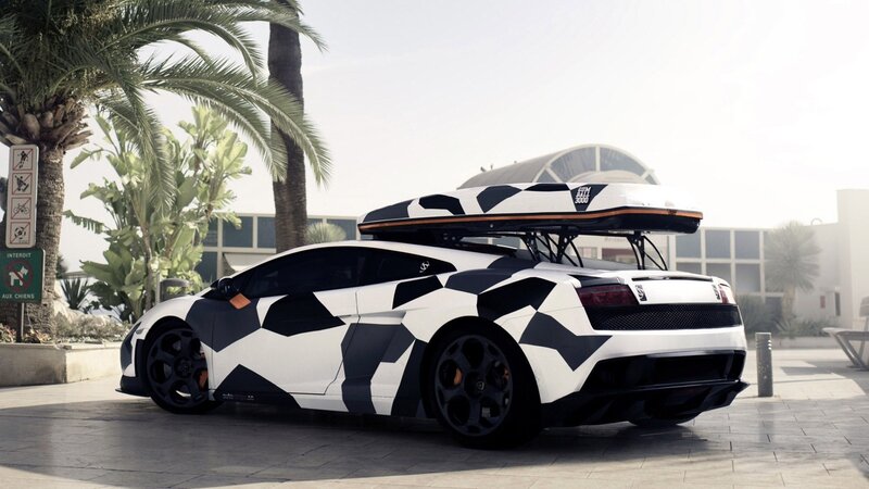 camouflaged sports car with surfboard