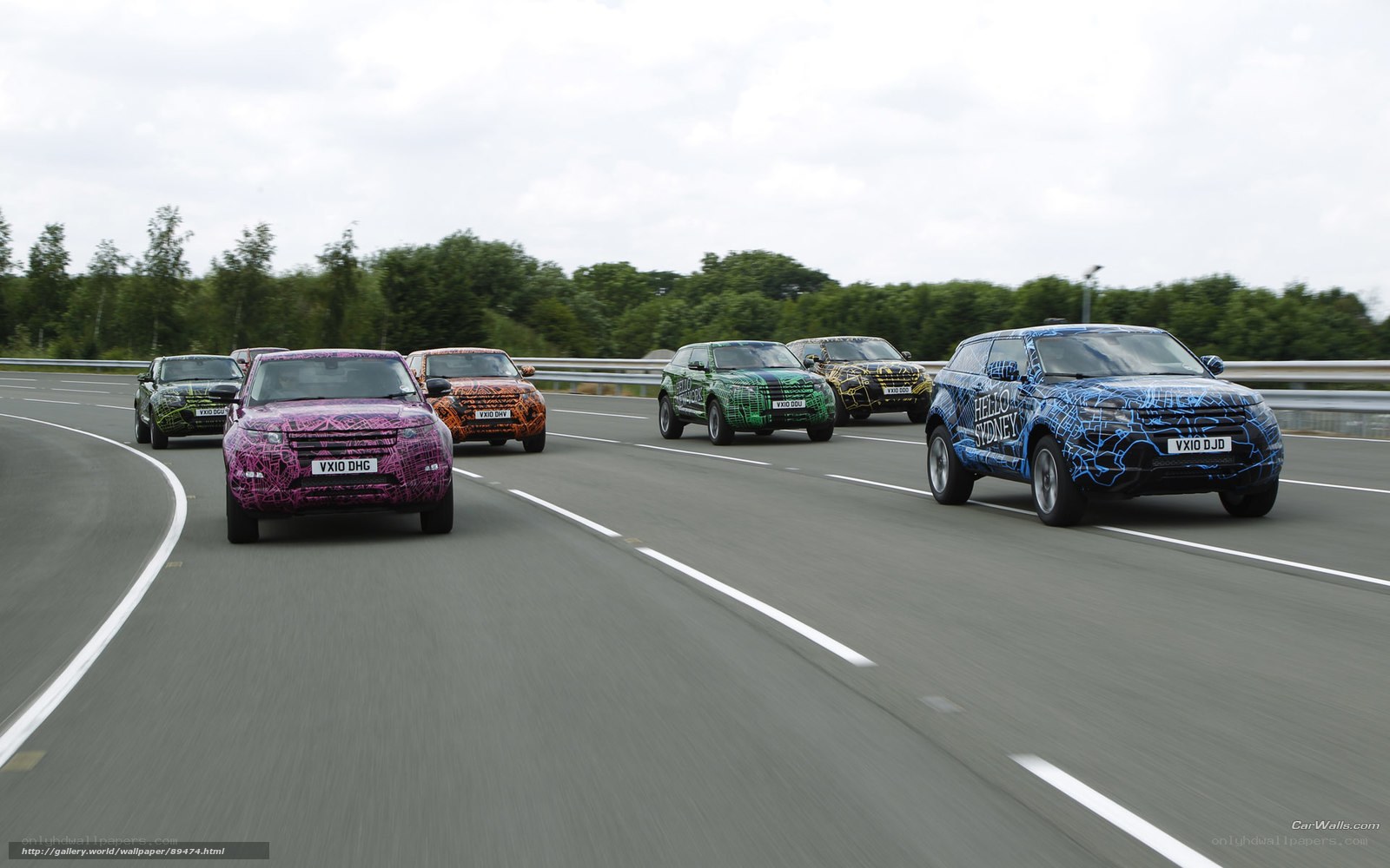 camouflaged SUVs on a track