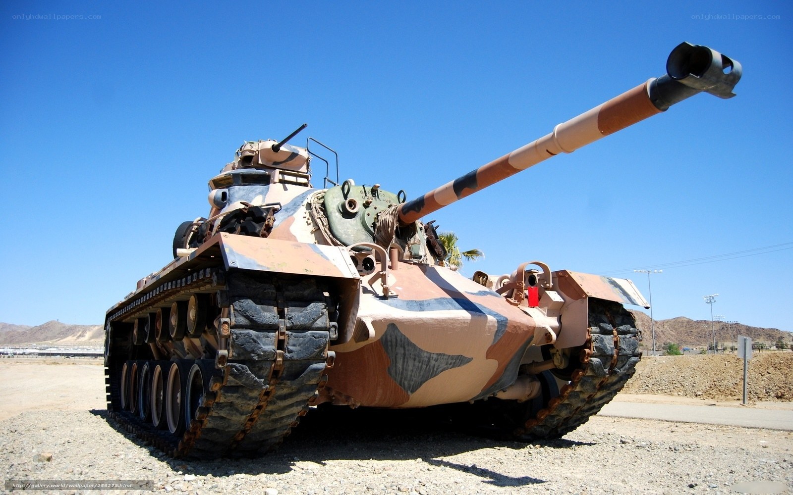 Camouflaged tank in desert