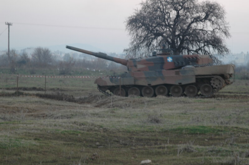 Camouflaged Tank in Field — Green