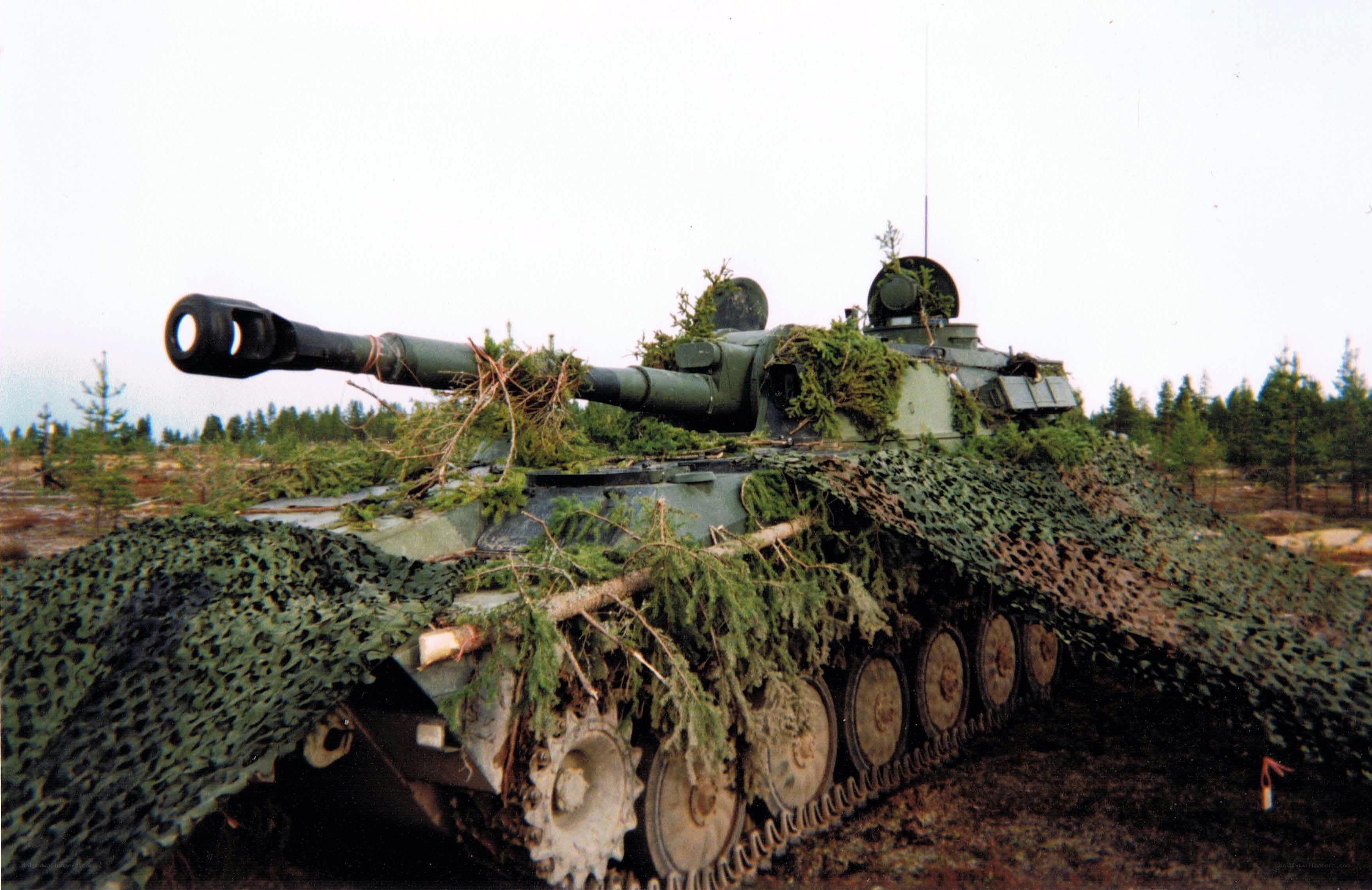 Camouflaged tank in forest